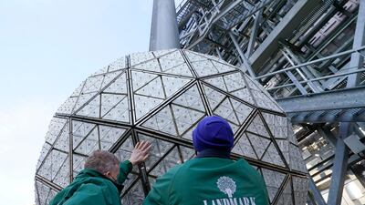 Workers secure a panel of Waterford crystal triangles on the Times Square New Year's Eve ball. AP