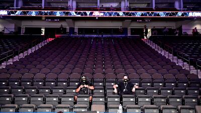 Members of the media watch the Heavyweight fight between Aleksei Oleinik of Russia and Fabricio Werdum of Brazil during UFC 249 at VyStar Veterans Memorial Arena in Jacksonville, Florida. AFP