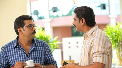 T P Aravindan’s role is played by Biju Menon, left, who makes a living by running a pharmacy in Salt Mango Tree. Courtesy 1000 Lights Entertainments