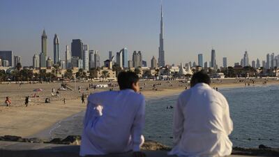 Those living in Dubai have a lot to be happy about, including this view of the city from Jumeirah Beach. But the borrowing habits of the young remain a concern for the Community Development Authority. Sarah Dea / The National
