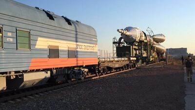 The Soyuz- FG carrier trundles along the back of a train close to the Russian-run Baikonur Cosmodrome in rural Kazakhstan. James Langton / The National