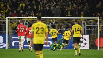 Marco Reus scores Dortmund's second goal against PSV. AFP