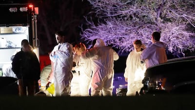 Members of law enforcement stage near the area where a suspect in a series of bombing attacks in Austin blew himself up as authorities closed in. Eric Gay / AP