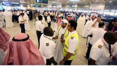 Kuwait Airways employees stopped work at the airport in Kuwait City Monday, demanding pay increases.
