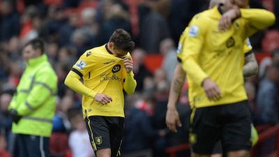 Aston Villa’s English midfielder Ashley Westwood (L) reacts as he leaves the pitch at the end of the Premier League football match between Manchester United and Aston Villa at Old Trafford in Manchester, north west England, on April 16, 2016. AFP / OLI SCARFF