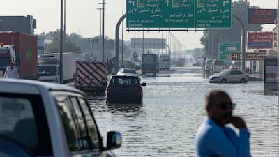 The D65 exit from Sheikh Zayed Road in Al Quoz, Dubai, remains flooded, with some cars still abandoned. Antonie Robertson / The National