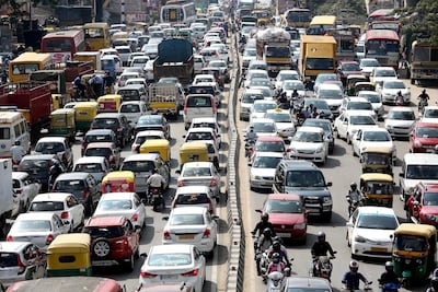 Cars, buses, trucks and rickshaws leave little room for cyclists on Bengaluru's congested roads. Jagadeesh NV / EPA