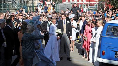 Bucking tradition, the bride arrived and left in a blue Volkswagen camper van. AP