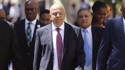 South Africa’s finance minister Pravin Gordhan, centre, arrives at the parliament to deliver the annual budget speech in Cape Town, South Africa in February. The minister was replaced by president Jacob Zuma on March 31, 2017, as part of a cabinet shuffle that changed 10 of the country’s 35 ministers. Schalk van Zuydam / AP file