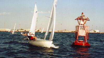 Dingy sailors rounding one of the local marker buoys at Umm Al Nar channel. Courtesy Amer Hamze and Abu Dhabi Saling Club