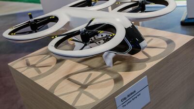 A model of a City Airbus flying taxi, developed by Airbus, sits on the company's stand during the Viva Technology conference in Paris. Marlene Awaad / Bloomberg