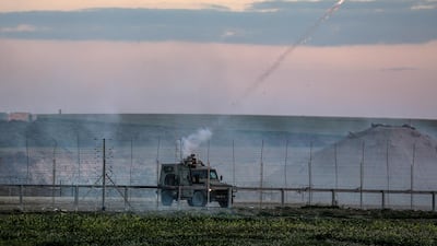 Israeli jeep fires tear-gas during clashes after Friday protests near the border between Israel and Gaza Strip. EPA