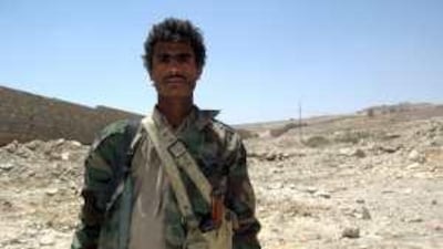 Naser Yahia Dhawi, 20, standing at al Jabal al Aswad military camp in Harf Sufian, is one of 400 tribal fighters backing the army in its offensive.