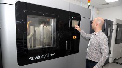 Pavels Senivs, production manager, shows off a 3D printing machine at the Paradigm 3D plant in Dubai. All photos: Pawan Singh / The National