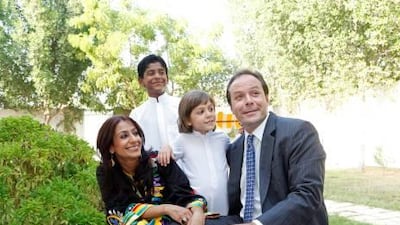 Hala Kazim with children Tariq Abdulla and Hassan Hamza, and husband Kamel Hassan Hamza. Until Sheikh Khalifa's announcement, Hassan was her only child not to qualify for Emirati citizenship.