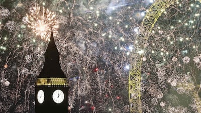 Fireworks explode around the London Eye and The Elizabeth Tower, commonly known by the name of the clock's bell, Big Ben, at the Palace of Westminster, home to the Houses of Parliament, in central London, just after midnight on January 1, 2024. AFP
