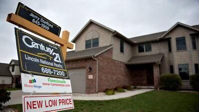 A foreclosure sign hangs outside a home in Peoria, Illinois. Patrick Flanery's latest novel, Fallen Land, unravels the story of a property developer in America's Midwest who goes bankrupt over a failed housing development. Daniel Acker / Bloomberg via Getty Images
