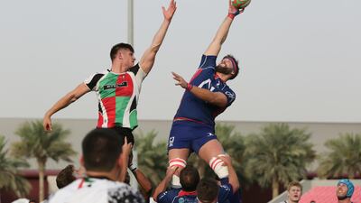 Patrick Jenkinson and Andy Buist vie for the ball. Victor Besa / The National