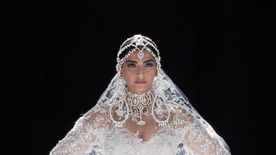 Sonam Kapoor looking very bridal when walking the runway for Ralph & Russo last year. Tamara Ralph and Michael Russo will attend the Mumbai wedding, which takes place on Tuesday. Getty Images
