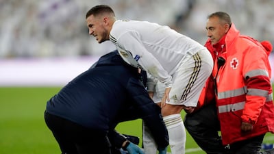 Real Madrid's Eden Hazard is injured during the Champions League match against Paris Saint Germain at the Bernabeu. AP