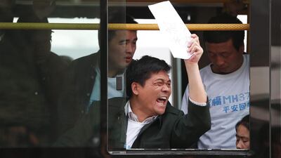 “Return our relatives,” around 200 family members cried at the gates of the Beijing mission, which was protected by a row of uniformed police and plain clothes security. Lintao Zhang / Getty Images