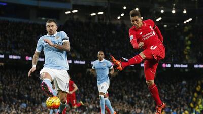 Football - Manchester City v Liverpool - Barclays Premier League - Etihad Stadium - 21/11/15Liverpool's Roberto Firmino shoots at goal past the challenge of Manchester City's Aleksandar KolarovReuters / Phil NobleLivepicEDITORIAL USE ONLY. No use with unauthorized audio, video, data, fixture lists, club/league logos or "live" services. Online in-match use limited to 45 images, no video emulation. No use in betting, games or single club/league/player publications. Please contact your account representative for further details.