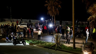 Lebanese gather at the site of an Israeli attack on Ramlet Al Baida, in Beirut. Reuters