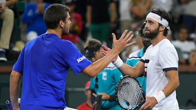 Cameron Norrie, left, of Britain, shakes hands with Nikoloz Basilashvili, of Georgia, after defeating him in the singles final at the BNP Paribas Open. AP Photo