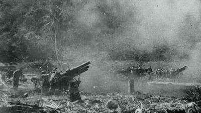 Second World War 155mm howitzers fire shells at enemy lines from advanced positions in Guadalcanal, Solomon Islands, where US Marines led the attack on Japanese forces, in January 1943. Getty Images