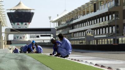Gardeners work to maintain the landscaped areas lining the track. Courtesy Seven Media