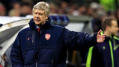 Arsene Wenger was left distraught by Arsenal's defeat against AC Milan.