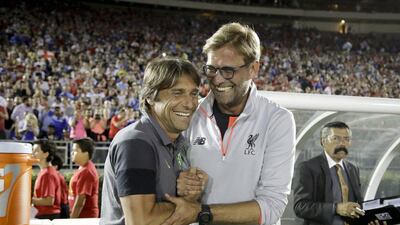 Liverpool manager Jurgen Klopp, right, and Chelsea's Antonio Conte share a laugh before the start of the International Champions Cup match at the Rose Bowl, Wednesday, July 27, 2016, in Pasadena, Calif. Jae C Hong / AP Photo