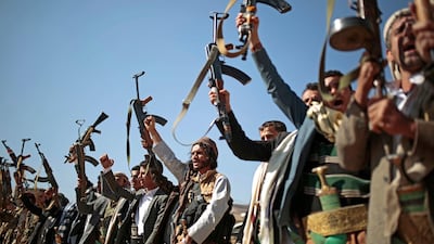 Tribesmen loyal to Houthi rebels hold up their weapons as they attend a gathering in Sanaa, Yemen. AP