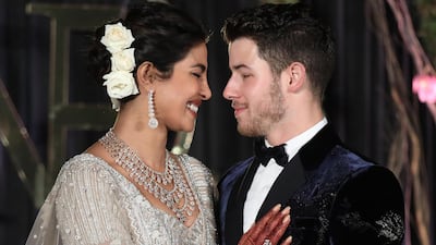 Newlyweds Priyanka Chopra, 36, and Nick Jonas, 26, pose for a photograph during a reception at a hotel in New Delhi on December 4, 2018. Photo: EPA