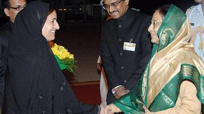 Indian President Pratibha Patil, right, is welcomed to Abu Dhabi by Foreign Trade Minister Sheikha Lubna Al Qasimi.