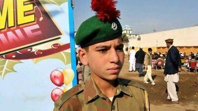 Naeem-ul Wahab, who lost both his parents in the conflict, welcomes guests to the Parwarish school. Muzammil Pasha / The National