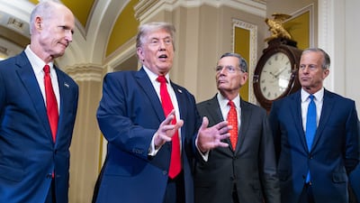 US President Donald Trump with Republican senators, from left, Rick Scott, John Barrasso and John Thune, on June 24. Bloomberg