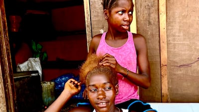 Two young women who live in Tombo's fishing community. Andy Scott / The National
