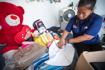 Sharon Toribio is boxing all her gifts for her family in the Philippines for the coming Christmas. Leslie Pableo for The National