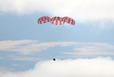 Nasa's unmanned Orion spaceship comes in for a splashdown in the Pacific Ocean off Baja California, Mexico, on December 11. AFP