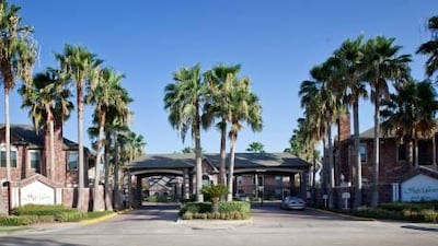 The entrance to the San Marin apartment complex, where Salem Saif Al Mazroui was killed while trying to help his father escape from armed intruders. One of the two teenagers arrested in connection with his murder could face the death penalty.