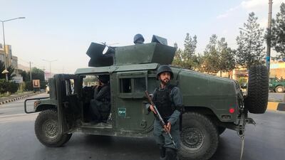An Afghan policeman keeps watch near the site of a blast in Kabul, Afghanistan July 28, 2019. REUTERS/Omar Sobhani
