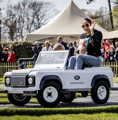 Meghan wears a cropped tweed Celine jacket for an off-roading event at the games. AFP