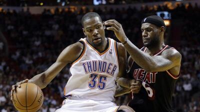 Kevin Durant, left, took first-place in NBA MVP voting over second-place LeBron James, right. Alan Diaz / AP