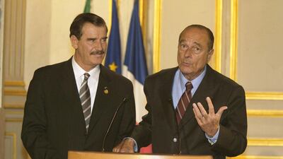Jacques Chirac gestures as he speaks at a media conference as Mexican President Vicente Fox stands nearby at Elysee Palace on November 15, 2002 in Paris. Getty Images