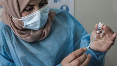 A health worker prepares an injection of the Sputnik V Covid-19 vaccine at Sabha Al-Harazin Clinic in Gaza City. Getty Images