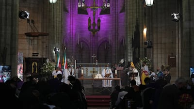 St George's Cathedral is lit in purple in honour of the Archbishop. AP