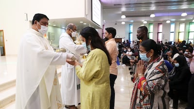 Father Andre during the Easter Sunday mass held at St. Mary's Catholic Church in Dubai. Pawan Singh / The National