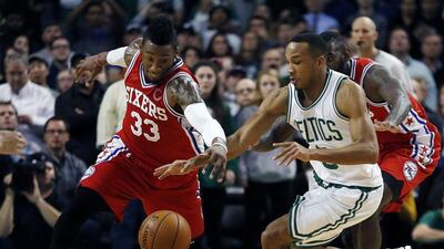 Philadelphia 76ers' Robert Covington and Boston Celtics' Avery Bradley . Michael Dwyer / AP Photo