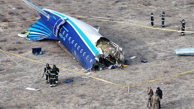 Emergency workers at the site where an Azerbaijan Airlines plane crashed, near the city of Aktau, in Kazakhstan. Reuters